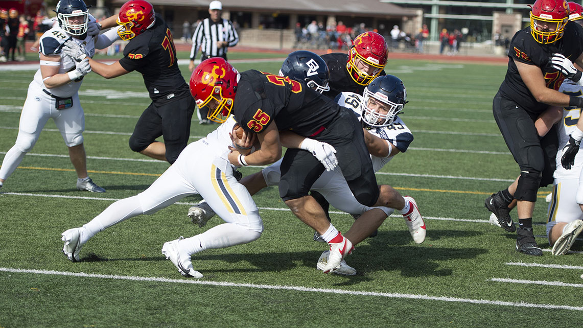 Freshman Hunter Ogle drags his defenders into the end zone