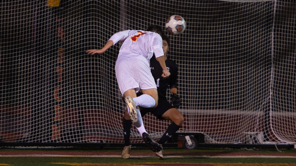 Junior Andrew Russell heads in the game-winner.