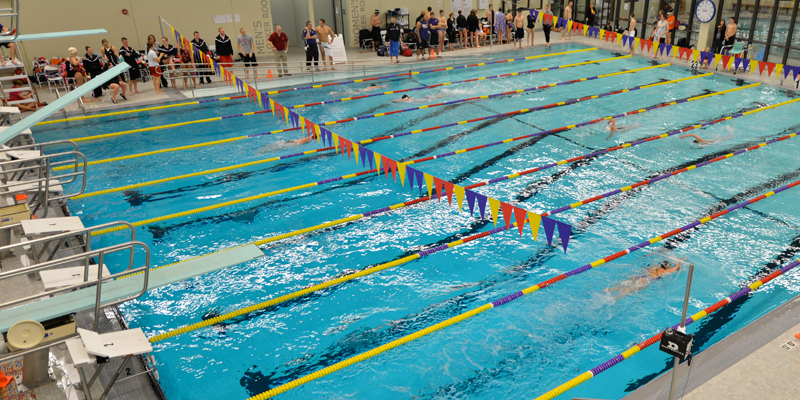 Swimming and diving teams drop close contest at Loras