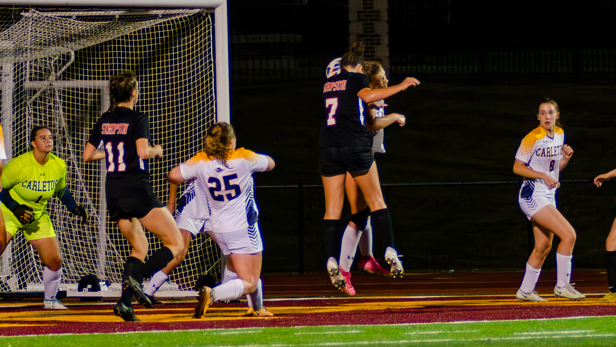 Julia Wagoner heads home the game-winning goal against Carleton. (photo by Morgan Rosenbeck)